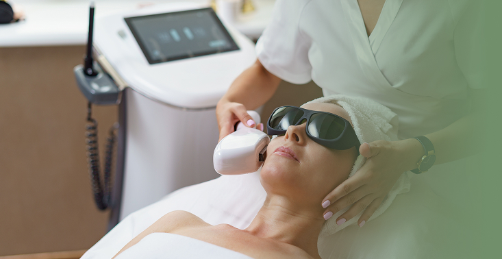 view doctor cosmetologist doing anti aging procedure cosmetology office satisfied woman disposable hat lying couch relaxing