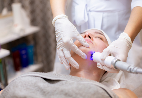 young beautiful girl lies beautician s table receives procedures